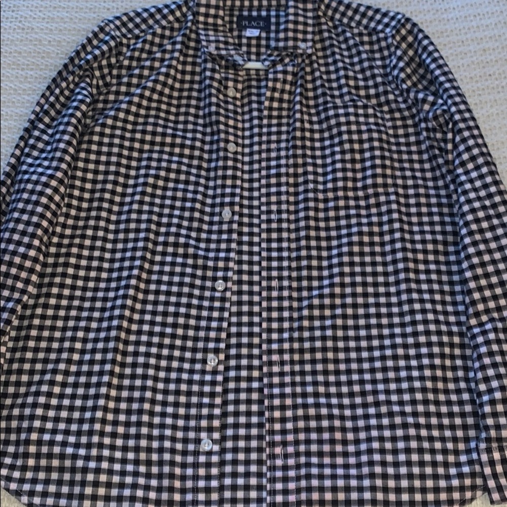 White and black tile shirt, and in good condition